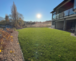 OK Valley Landscaping beige mulch and green lawn
